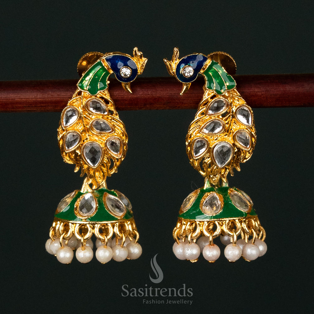 Elegant gold-plated earrings featuring a peacock design with kundan stones and pearls
