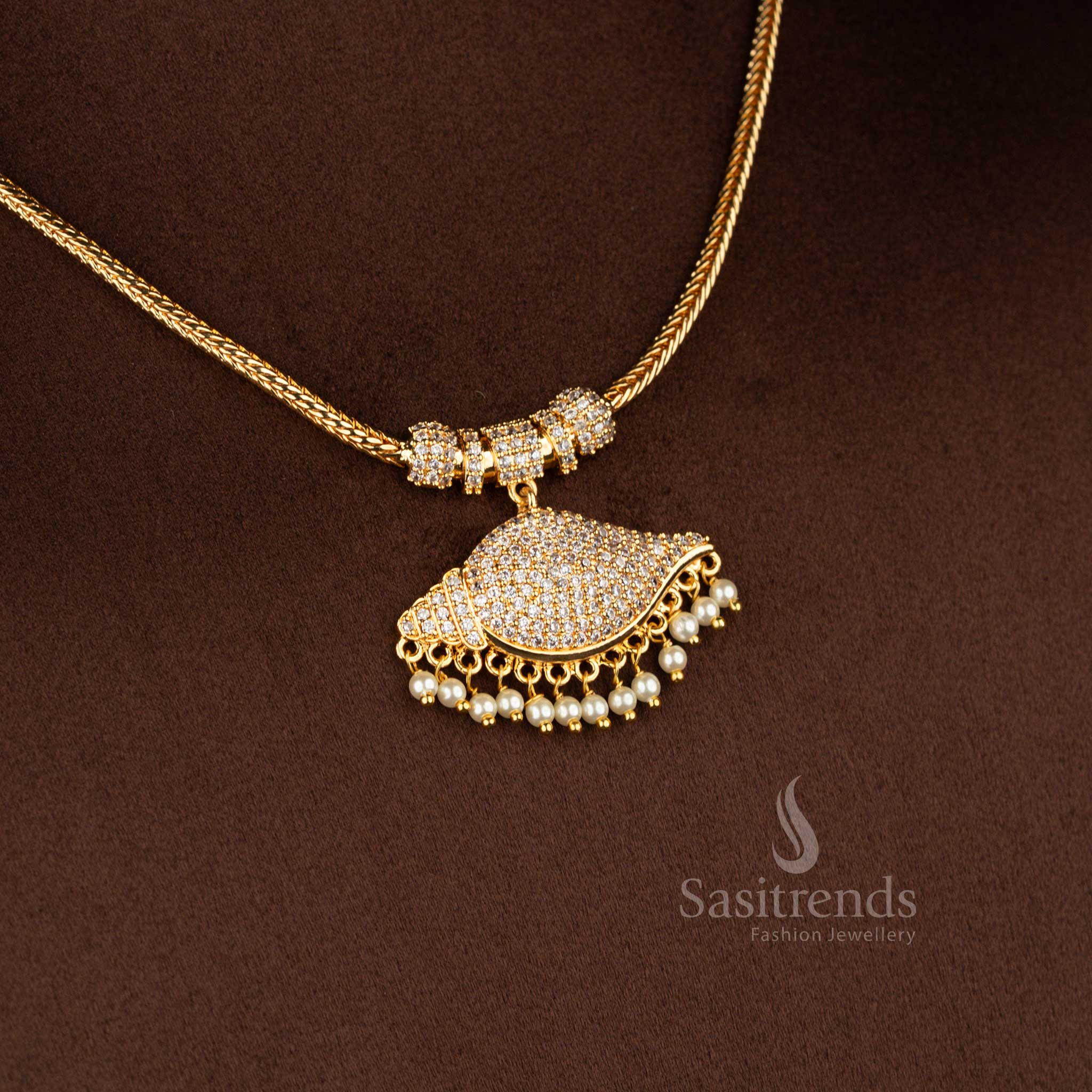 Sasitrends micro gold plated one gram pendant chain necklace featuring a curved mango-inspired pendant structure set with white AD stones, paired with a smooth snake chain that delivers a 24K real gold look, traditional design with guaranteed finish.