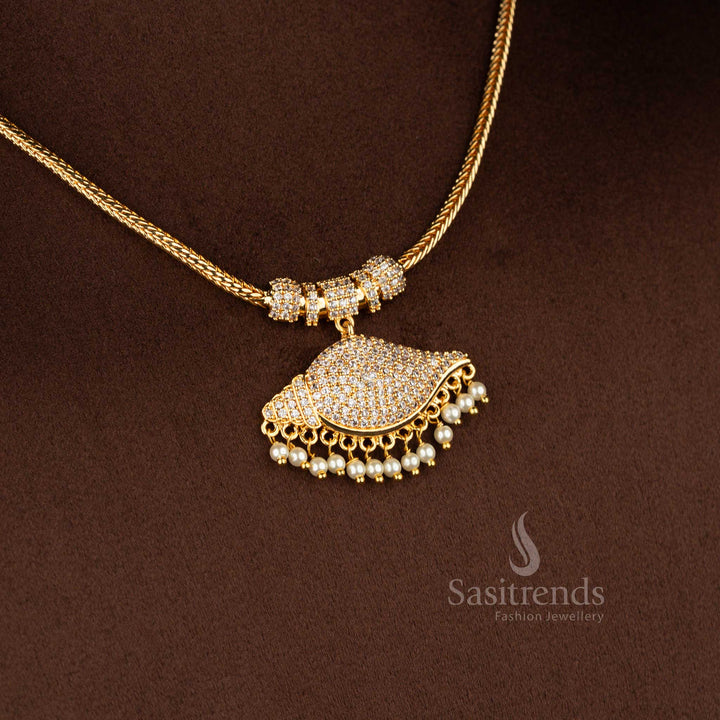 Sasitrends micro gold plated one gram pendant chain necklace featuring a curved mango-inspired pendant structure set with white AD stones, paired with a smooth snake chain that delivers a 24K real gold look, traditional design with guaranteed finish.