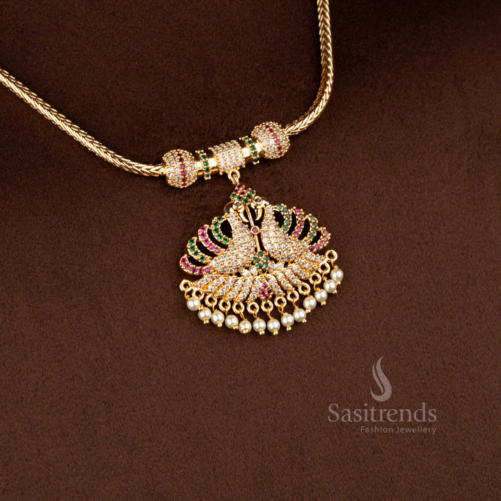 Sasitrends micro gold plated one gram pendant chain necklace featuring a dual peacock pendant structure embellished with multi colour AD stones and pearl drop accents, ideal for festive occasions and vibrant ethnic saree styling.