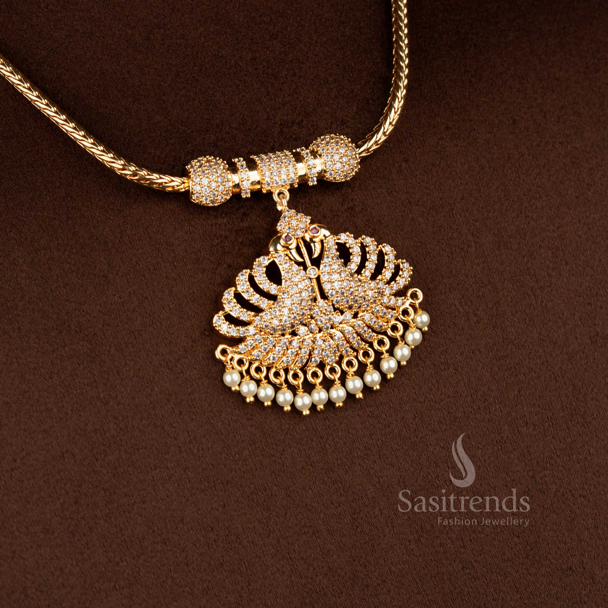 Sasitrends traditional one gram pendant chain necklace designed with a mirrored leaf-shaped pendant structure highlighted by white AD stones and bordered with delicate pearl hangings, offering a refined gold-like traditional finish.