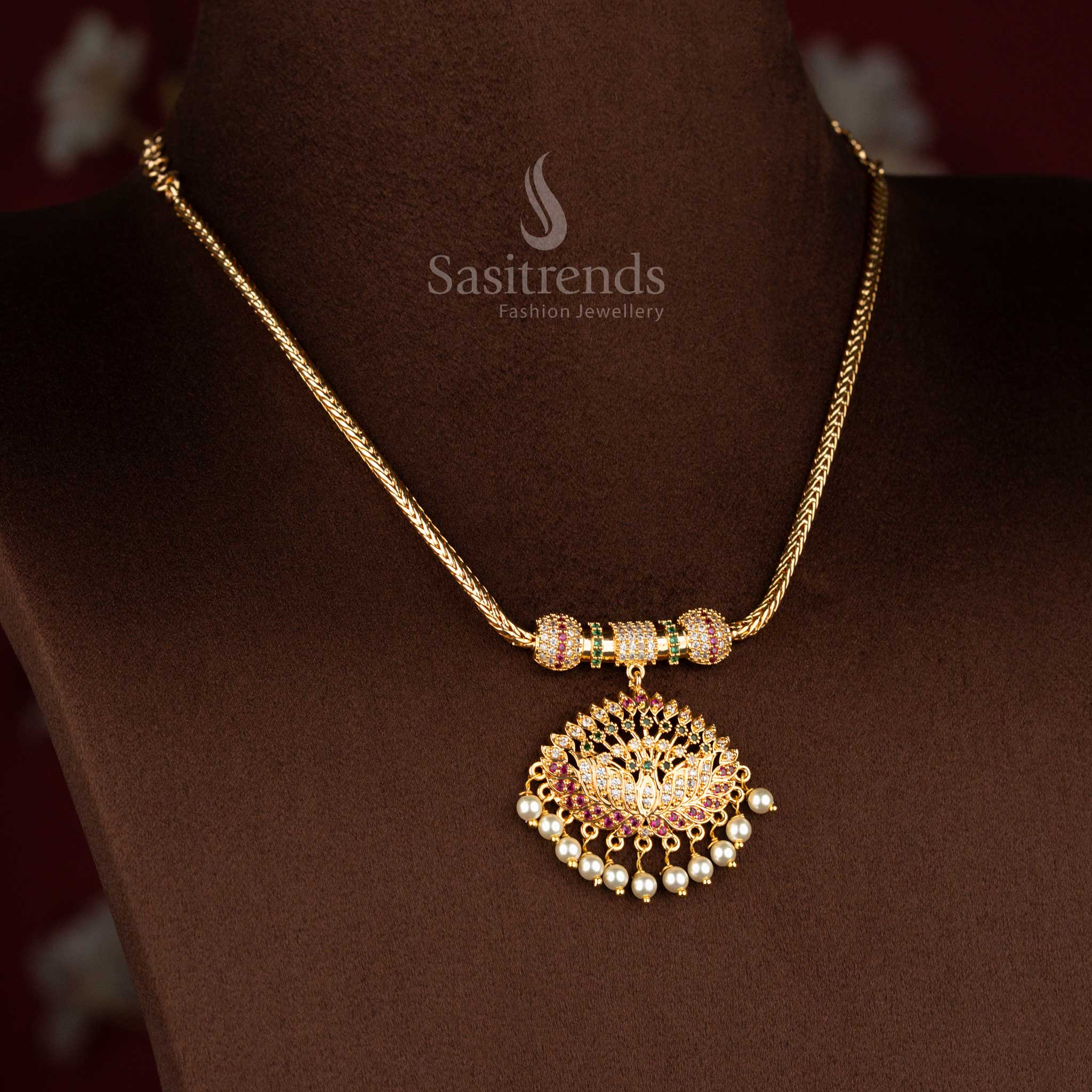 Sasitrends micro gold plated pendant chain necklace showcasing a detailed lotus motif pendant structure adorned with multi colour AD stones and pearl drops, completed with a smooth chain for an authentic traditional finish.
