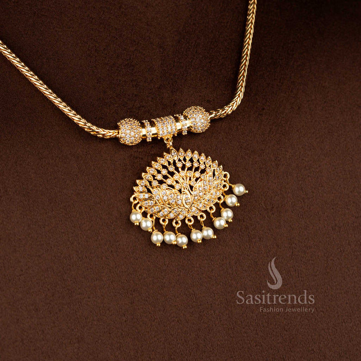 Sasitrends micro gold plated one gram pendant chain necklace featuring a symmetrical lotus motif pendant structure set with white AD stones, finished with pearl drop hangings and paired with a textured chain for a rich 24K real gold look.