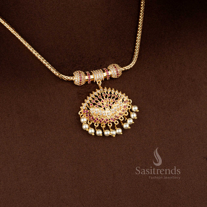 Sasitrends traditional pendant chain necklace featuring a sculpted lotus design pendant structure adorned with white AD stones and white ruby accents, bordered with pearl hangings and paired with a flexible gold-tone chain.