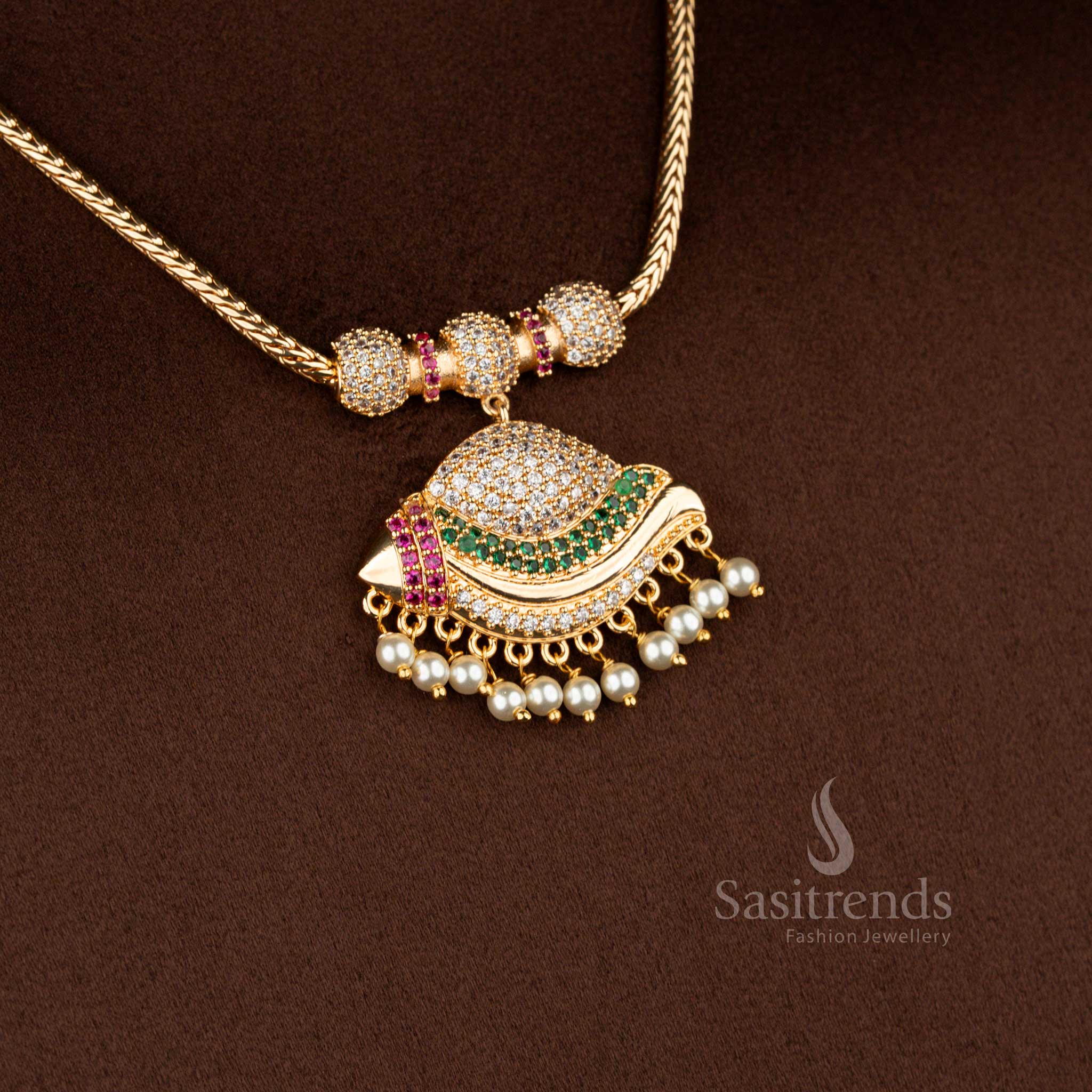 Sasitrends micro gold plated one gram pendant chain necklace featuring a layered crescent-shaped pendant structure embellished with multi colour AD stones and pearl drop accents, paired with a gold-tone chain for a festive real gold look.
