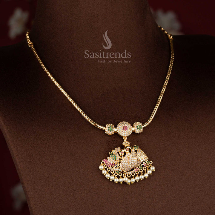 Sasitrends micro gold plated one gram pendant chain necklace featuring a single peacock pendant structure embellished with multi colour AD stones and pearl drop accents, ideal for festive functions and vibrant ethnic sarees.