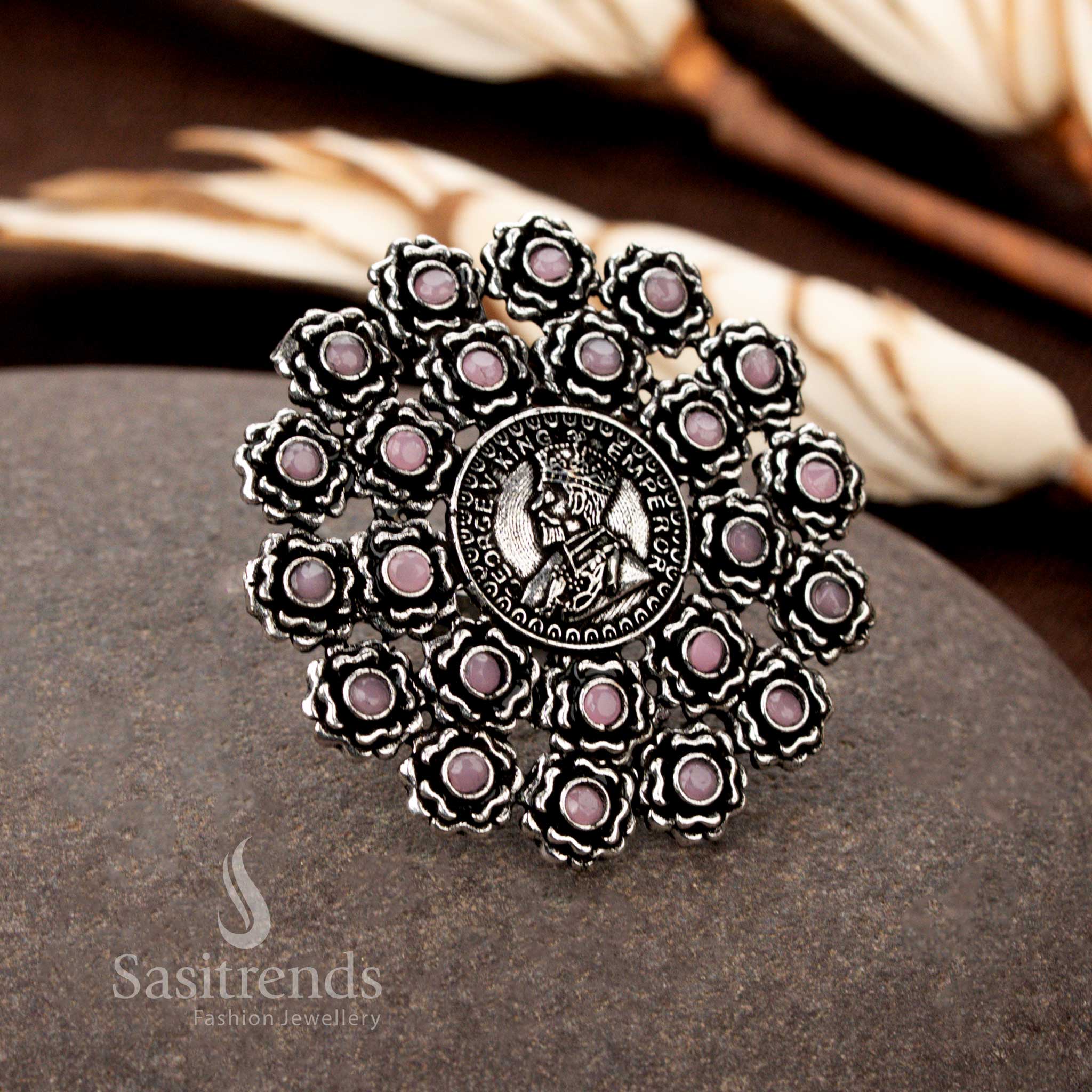 A grand vintage oxidised floral coin ring with intricate etchings and a pastel pink gemstone accent, ideal for those who love delicate yet regal jewellery - Sasitrends