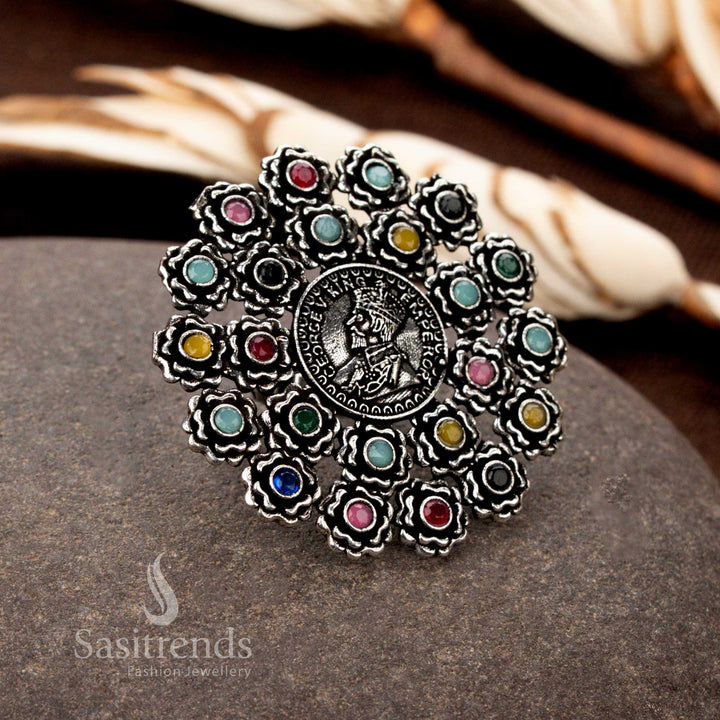 A colourful oxidised floral coin ring with handcrafted designs, adorned with multi-gemstone accents, perfect for adding vibrancy to ethnic ensembles - Sasitrends