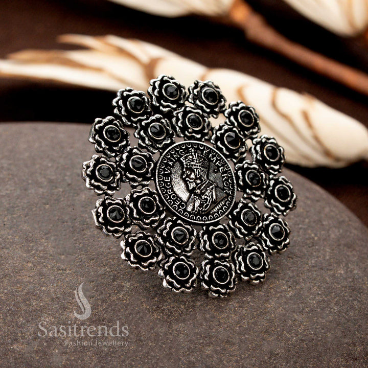  A majestic oxidised floral coin ring with detailed carvings and onyx black gemstone ornamentation, bringing a powerful and elegant aura - Sasitrends