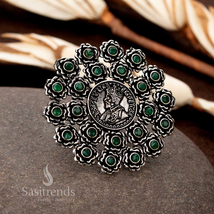 Timeless oxidised ring with finely sculpted floral coin ornamentation and a deep green gemstone accent, perfect for vintage and traditional styling - Sasitrends
