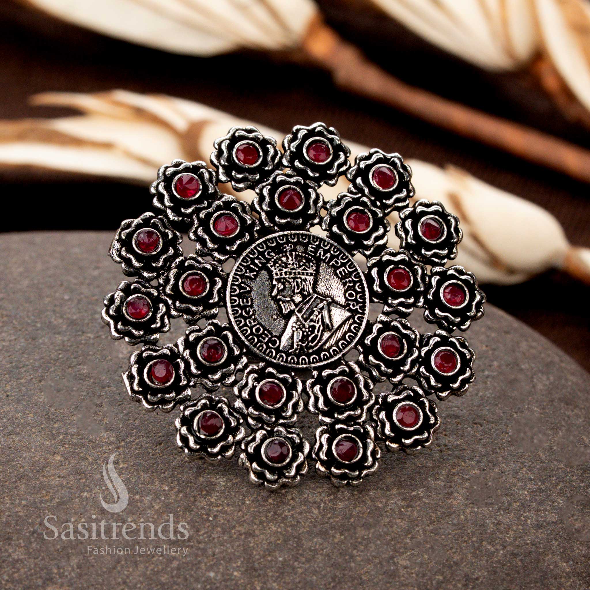 Exquisite vintage oxidised floral coin pattern ring featuring intricate handcrafted details, adorned with royal ruby stone accents, offering a regal touch to traditional jewellery collections - Sasitrends