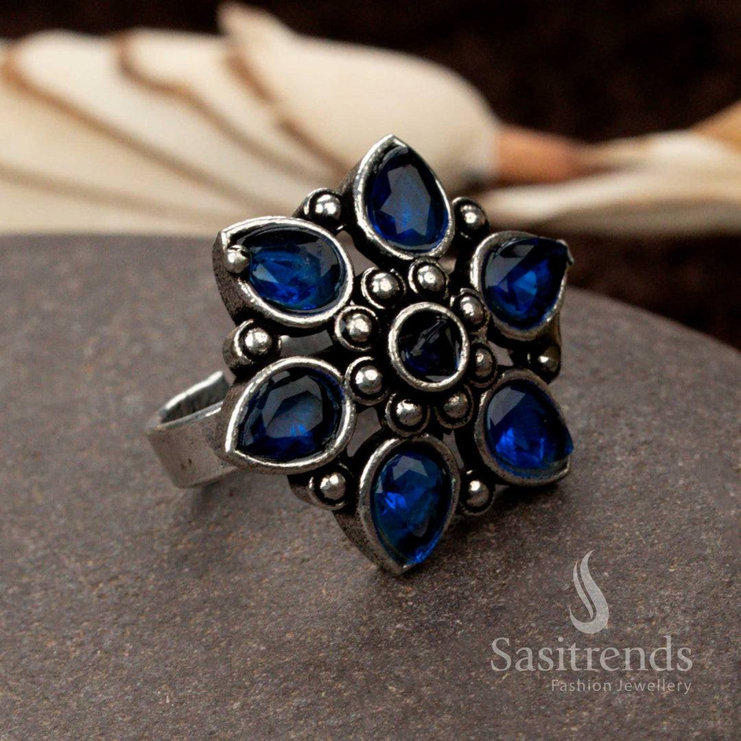 Handcrafted oxidised adjustable ring with a vivid blue gemstone, offering a blend of tradition and modern elegance - Sasitrends