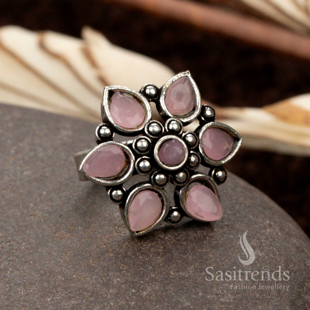 Charming oxidised floral ring with a soft pink stone, adding a touch of femininity and grace - Sasitrends