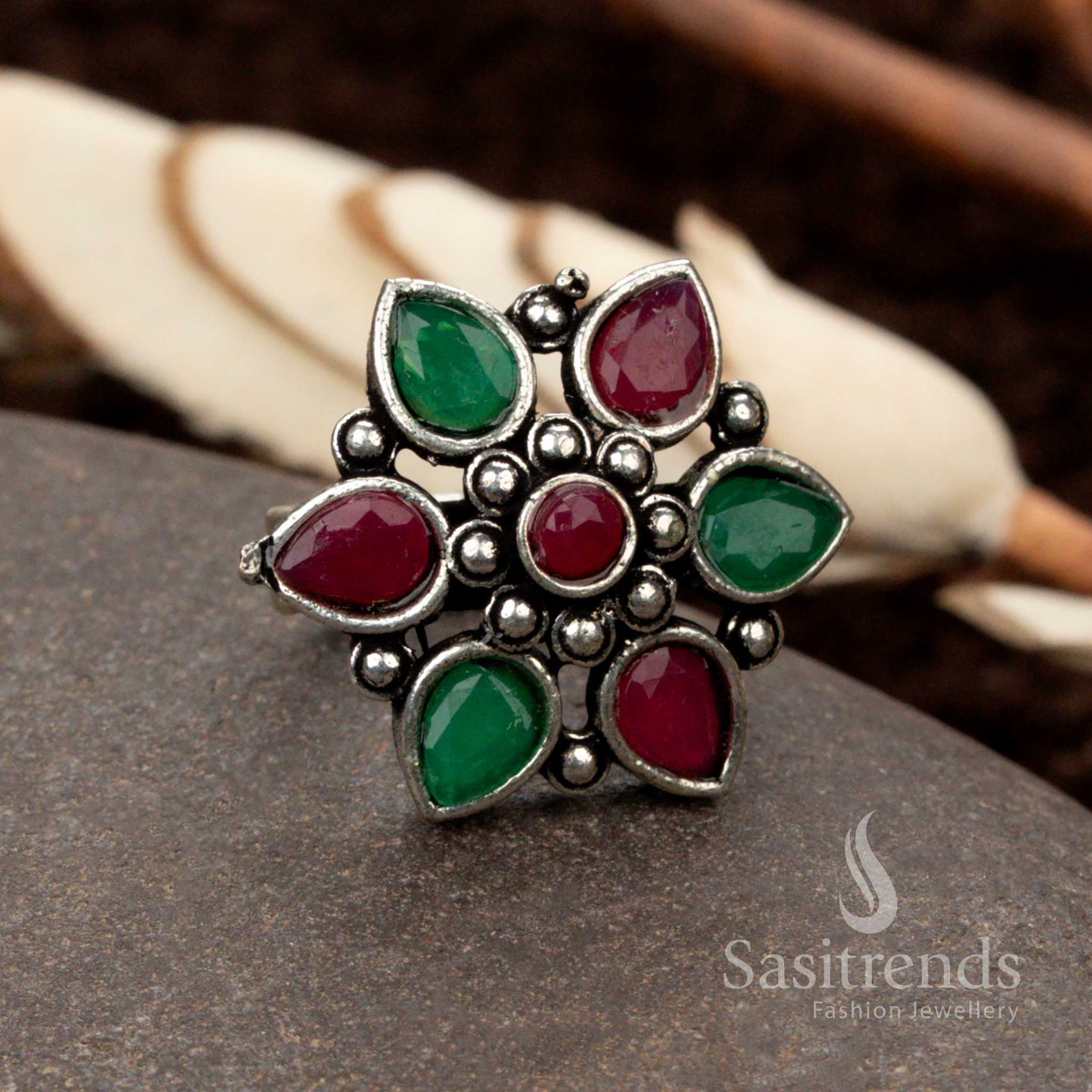 Elegant oxidised floral ring featuring a ruby-green dual stone combination, embodying a royal and festive charm - Sasitrends