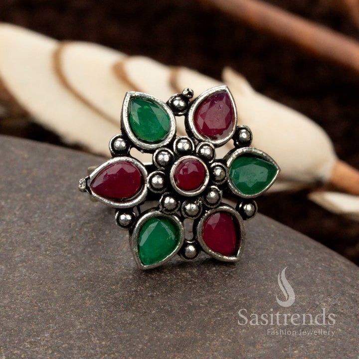 Elegant oxidised floral ring featuring a ruby-green dual stone combination, embodying a royal and festive charm - Sasitrends