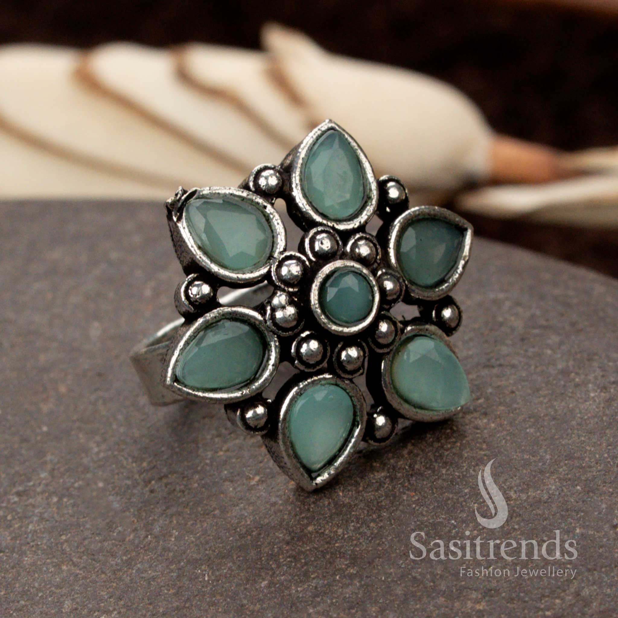 Refreshing oxidised floral design ring with a soothing mint stone, embodying freshness and uniqueness - Sasitrends