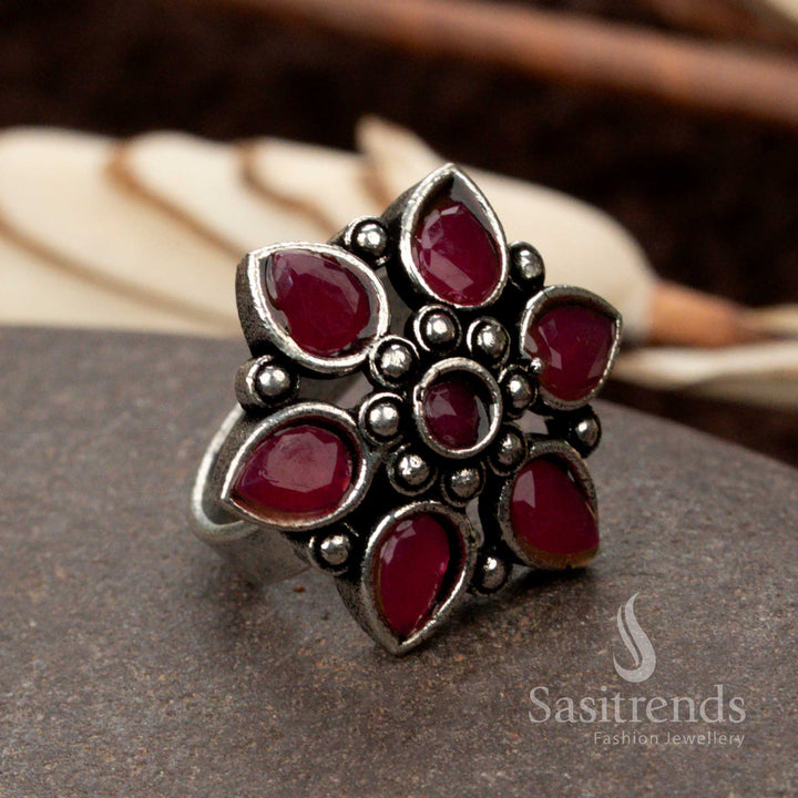 Stunning oxidised floral design ring with a deep red ruby stone, symbolizing passion and elegance - Sasitrends