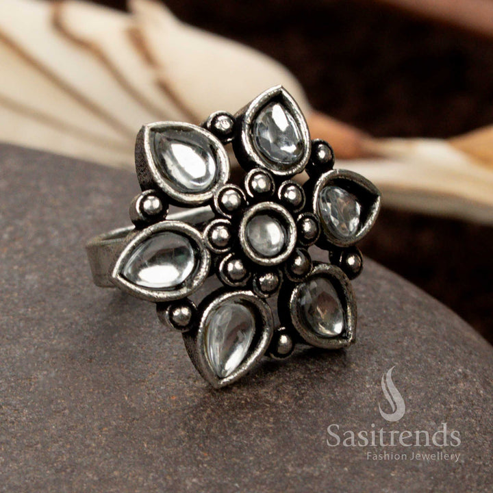 Graceful oxidised floral design ring with a luminous white stone, exuding purity and timeless beauty - Sasitrends