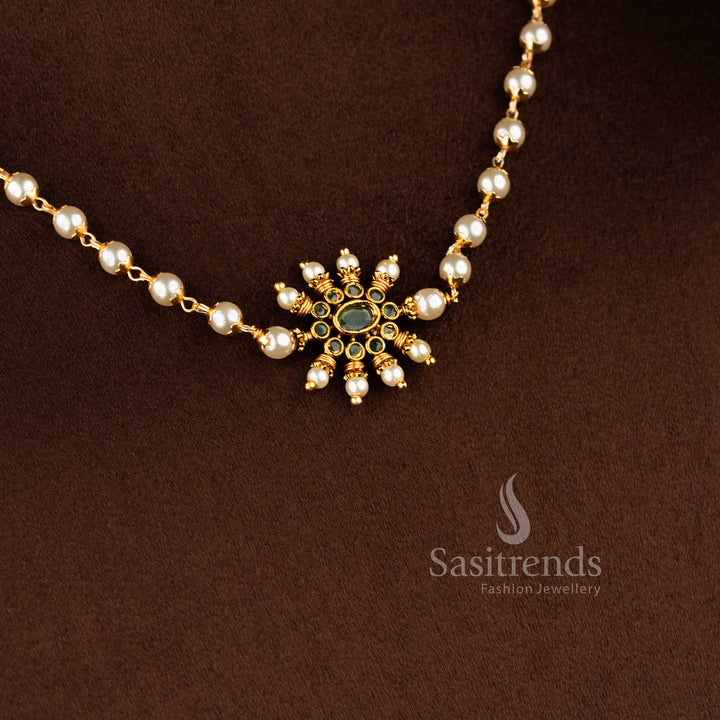 Traditional matte gold necklace featuring a central sunburst floral pendant and elegant pearl string 1949 - Sasitrends