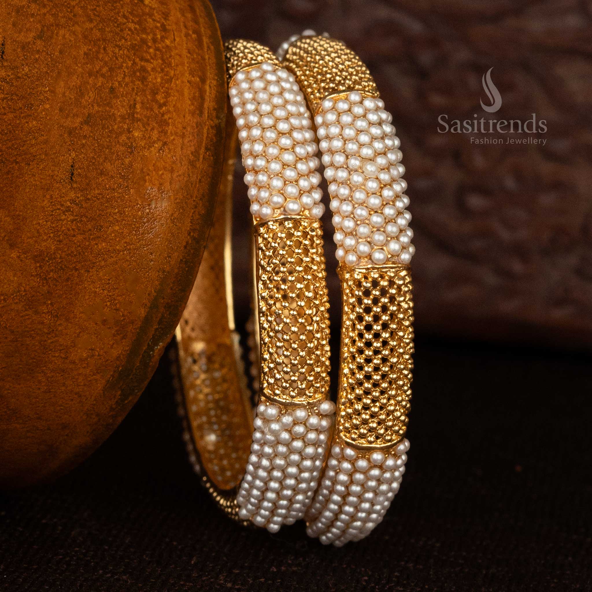 Matte finish gold bangles with traditional temple motifs for festive occasions - Sasitrends