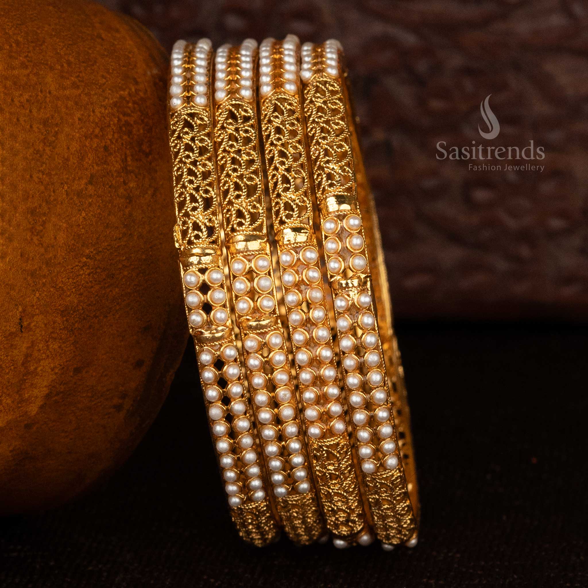 Peacock motif temple bangles with matte gold plating and intricate designs - Sasitrends