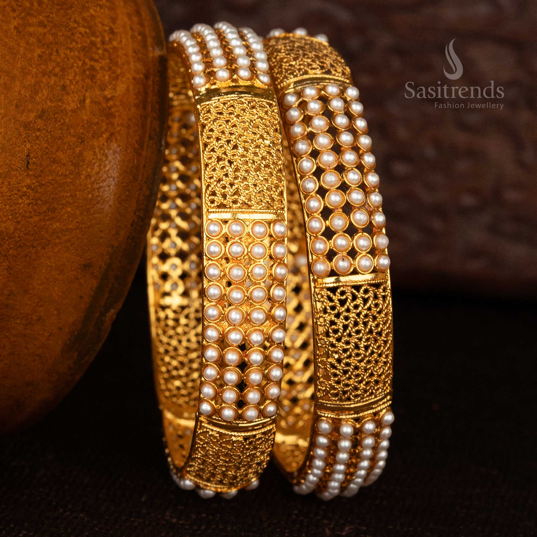 Ruby and emerald-studded temple bangles with matte gold finish - Sasitrends