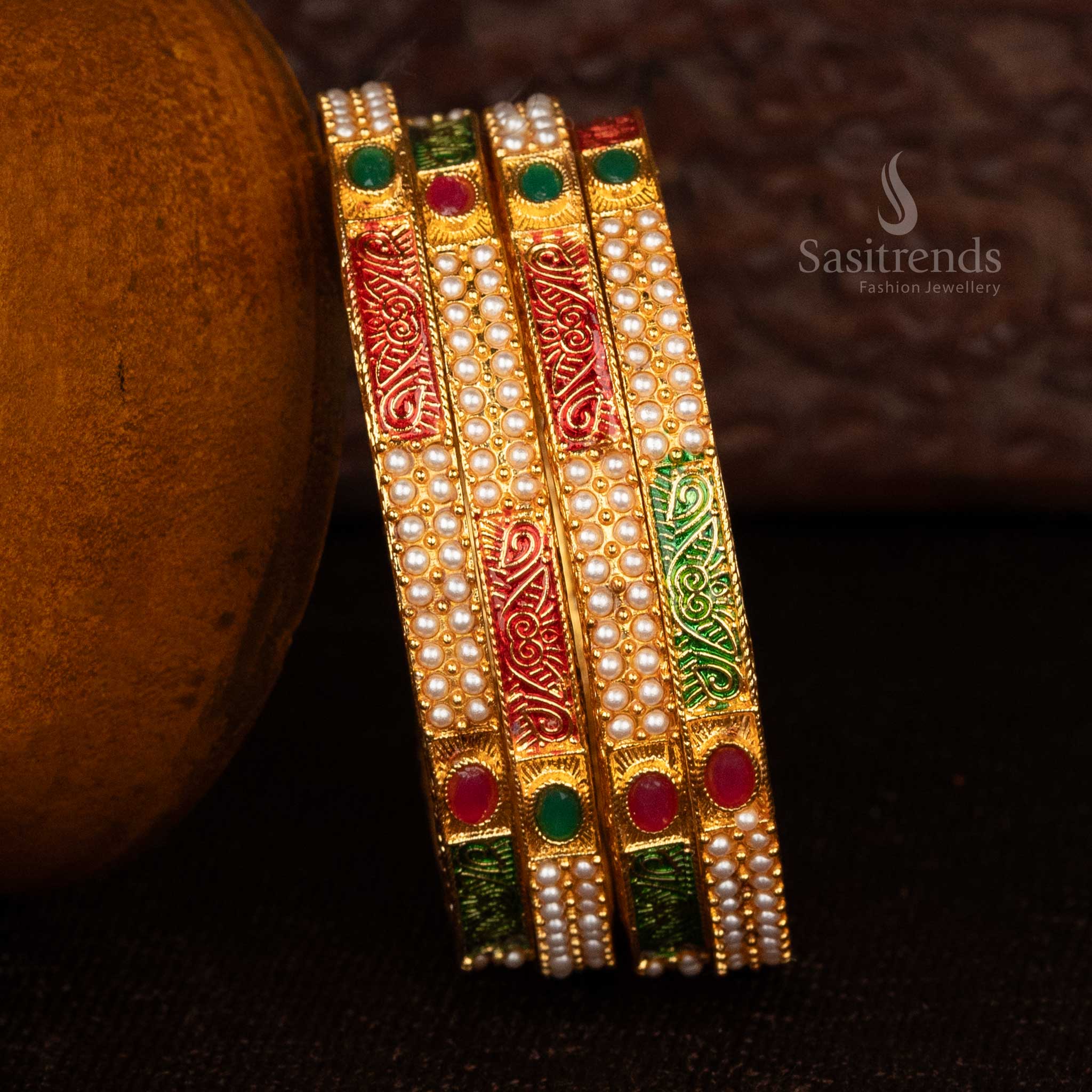 Elegant matte gold-plated bangles with temple-inspired designs - Sasitrends