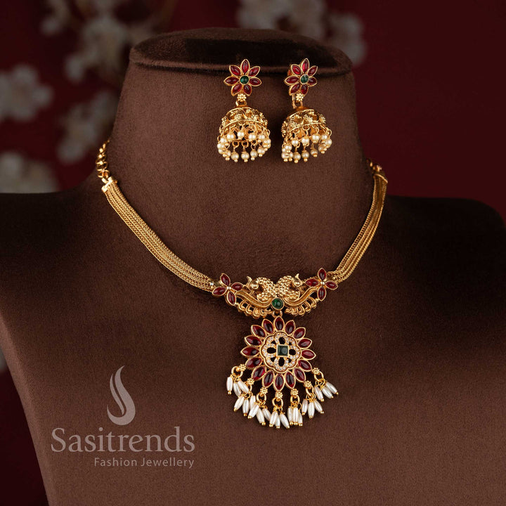 Elegant classic matte gold starburst pendant with matching rice pearl jhumkas.