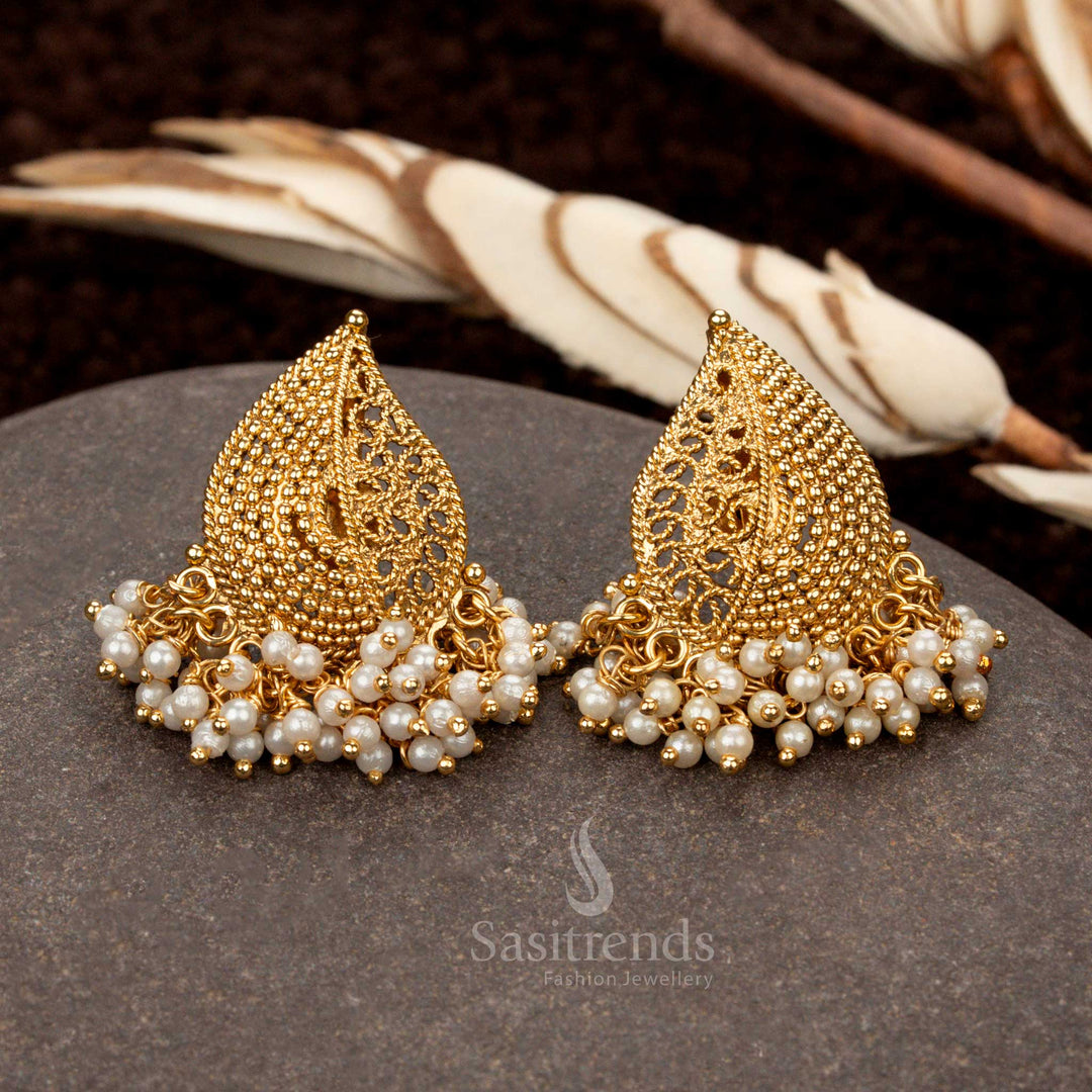 Traditional temple wear earrings featuring a mango motif with delicate pearl hangings - Sasitrends