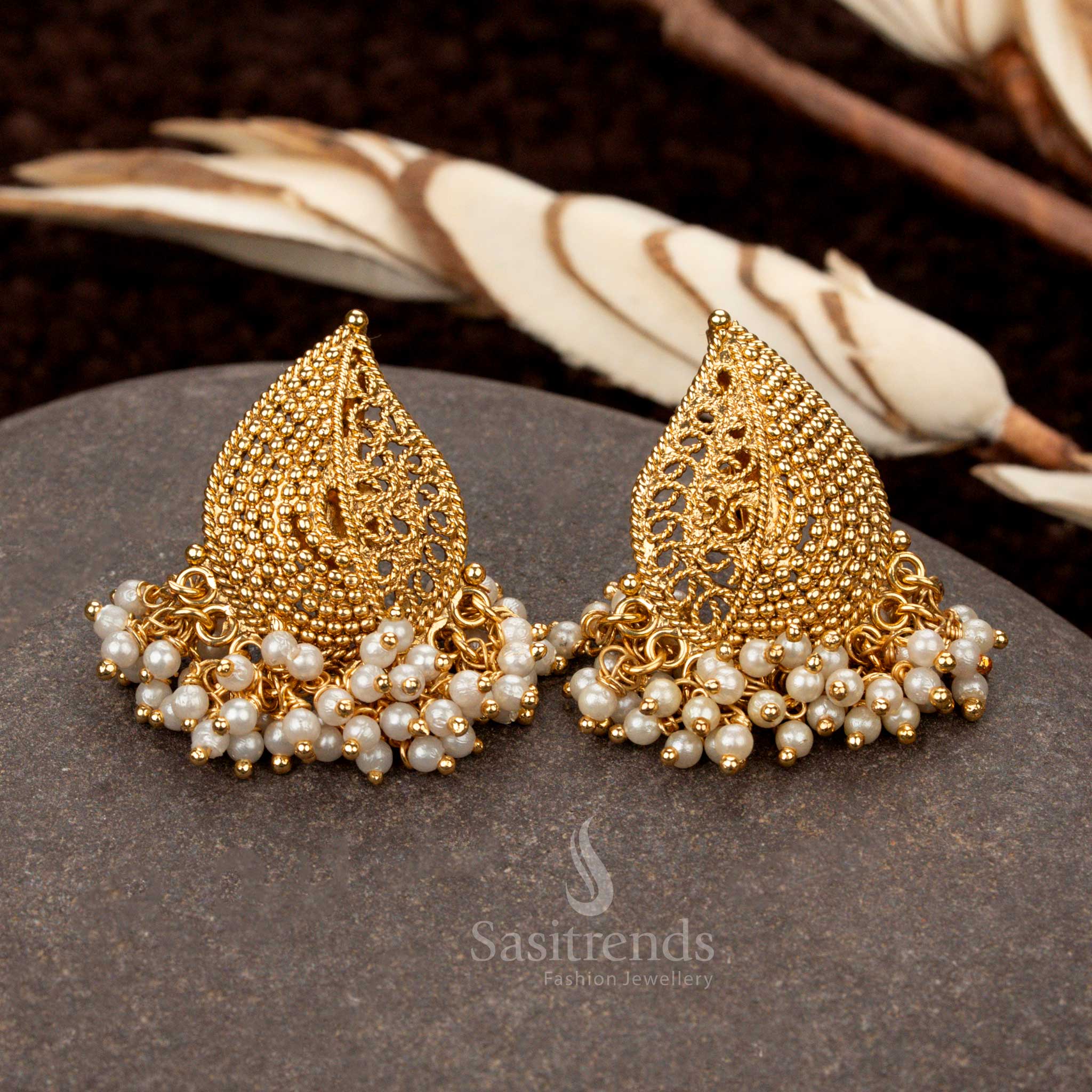 Traditional temple wear earrings featuring a mango motif with delicate pearl hangings - Sasitrends