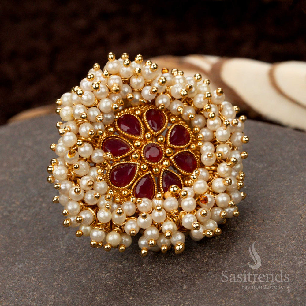 Ornate and royal antique gold-plated statement ring with a ruby floral pearl cluster design, adding a regal touch to festive jewellery collections - Sasitrends
