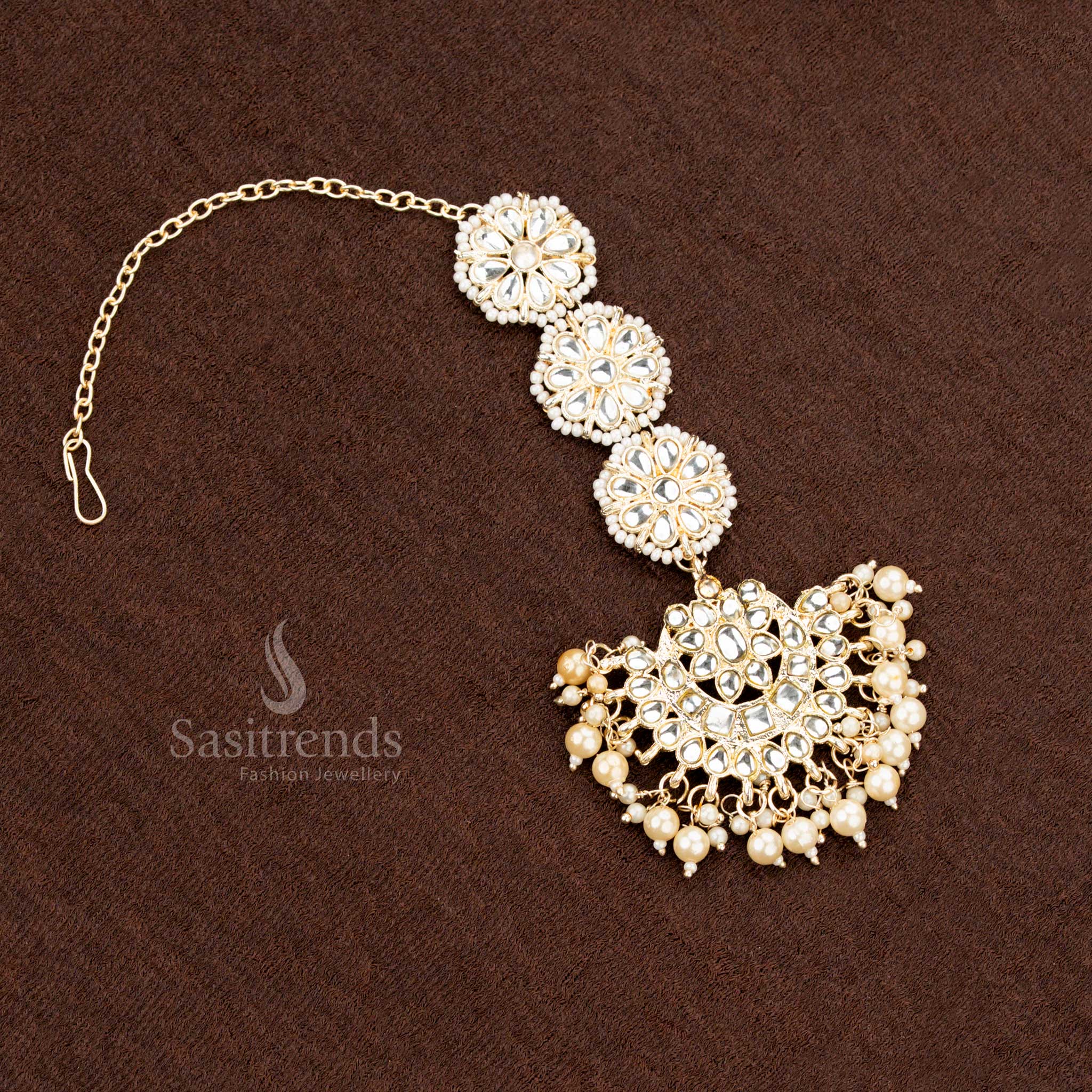Gold plated bridal jewellery set with floral earrings and matching maang tikka - Sasitrends