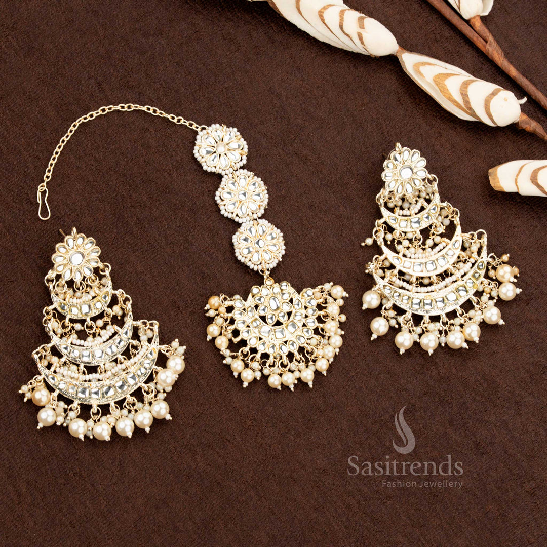 Traditional gold plated bridal earrings and tikka set with stone and pearl detailing - Sasitrends