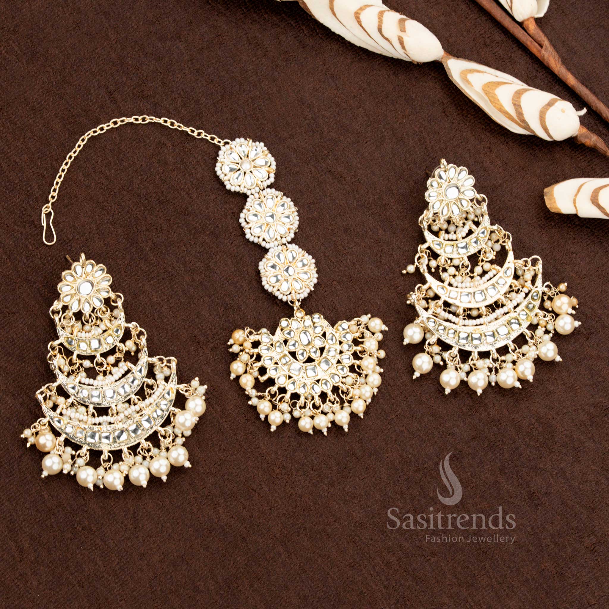 Traditional gold plated bridal earrings and tikka set with stone and pearl detailing - Sasitrends