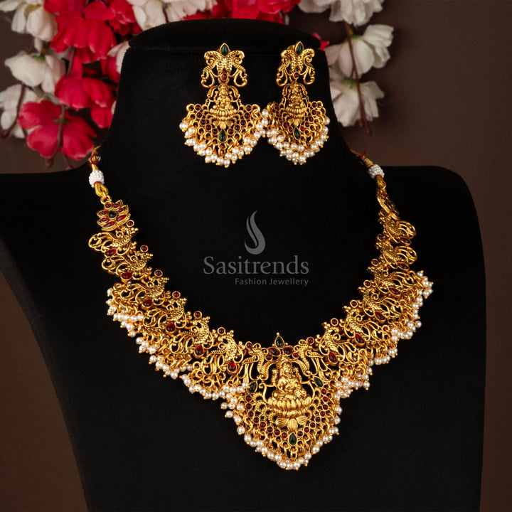 Royal heritage matte gold finish Lakshmi peacock temple necklace jewellery set, beautifully adorned with ruby-green stones for a festive and ethnic statement - Sasitrends