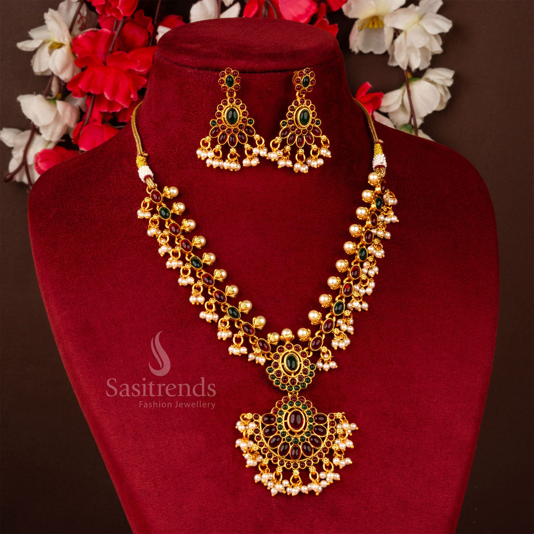 Classic matte gold plated floral and oval ruby-green stone pendant necklace jewellery set, designed with intricate temple-inspired craftsmanship for an ethnic touch - Sasitrends