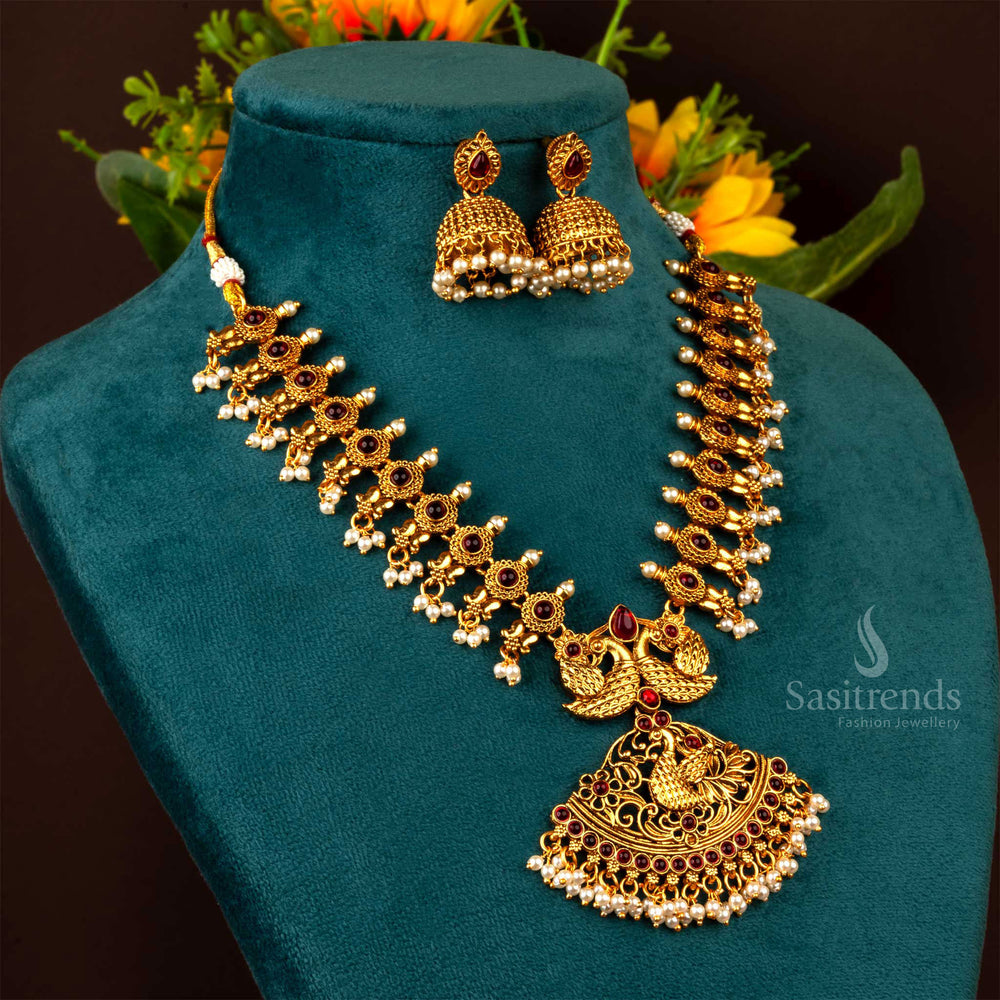 Exquisite matte gold finish temple-style necklace jewellery set adorned with peacock motifs and dazzling ruby ZX stones, perfect for weddings and ethnic occasions - Sasitrends