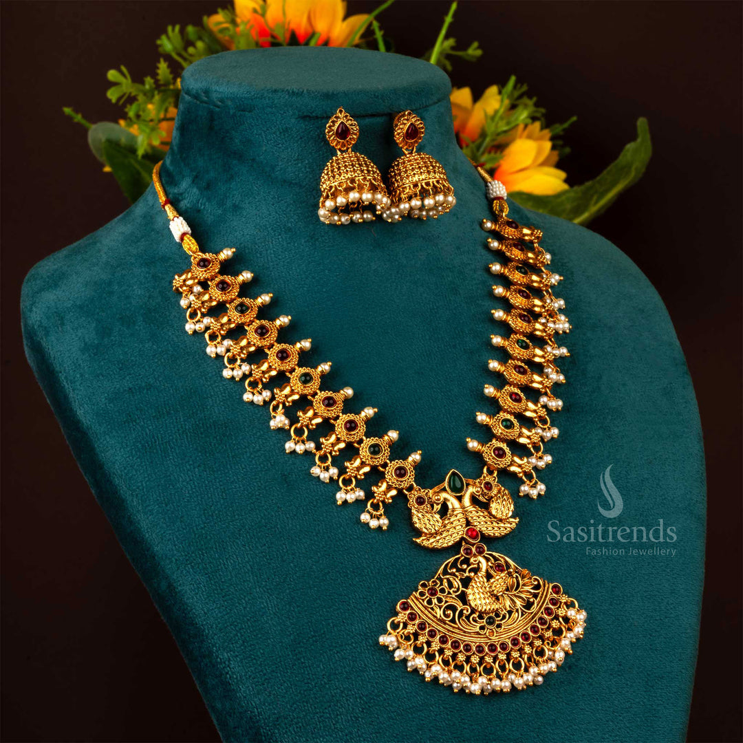 Intricately designed matte finish gold temple peacock necklace jewellery set featuring ruby-green ZX stones, exuding a heritage-inspired festive charm - Sasitrends