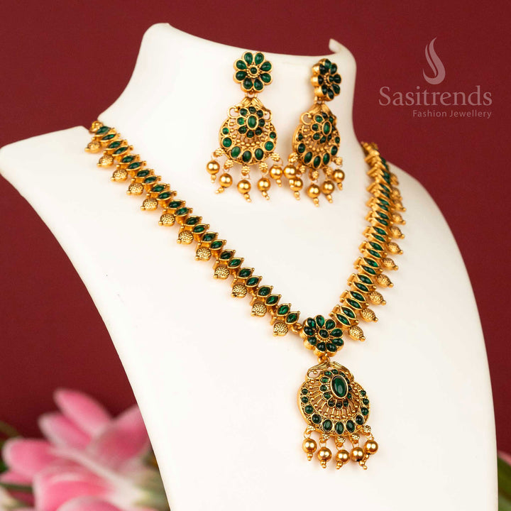 Intricate temple-style floral necklace jewellery set in matte gold plating, enriched with deep green stones for a majestic and timeless appeal - Sasitrends