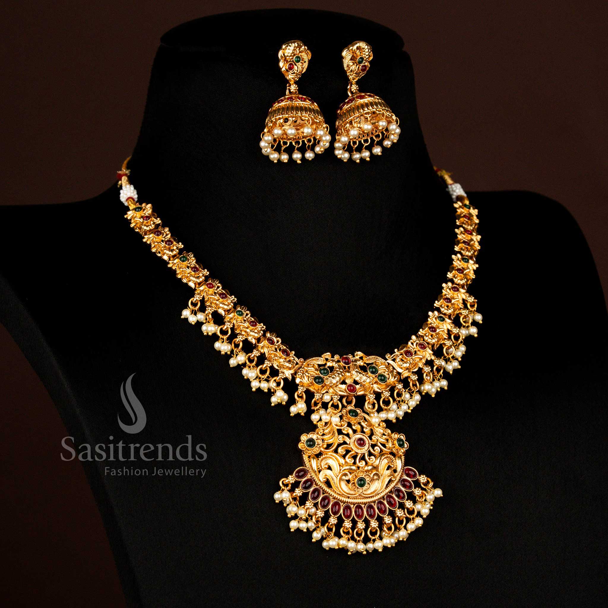 Classic peacock floral matte gold plated necklace with dome jhumkas Sasitrends