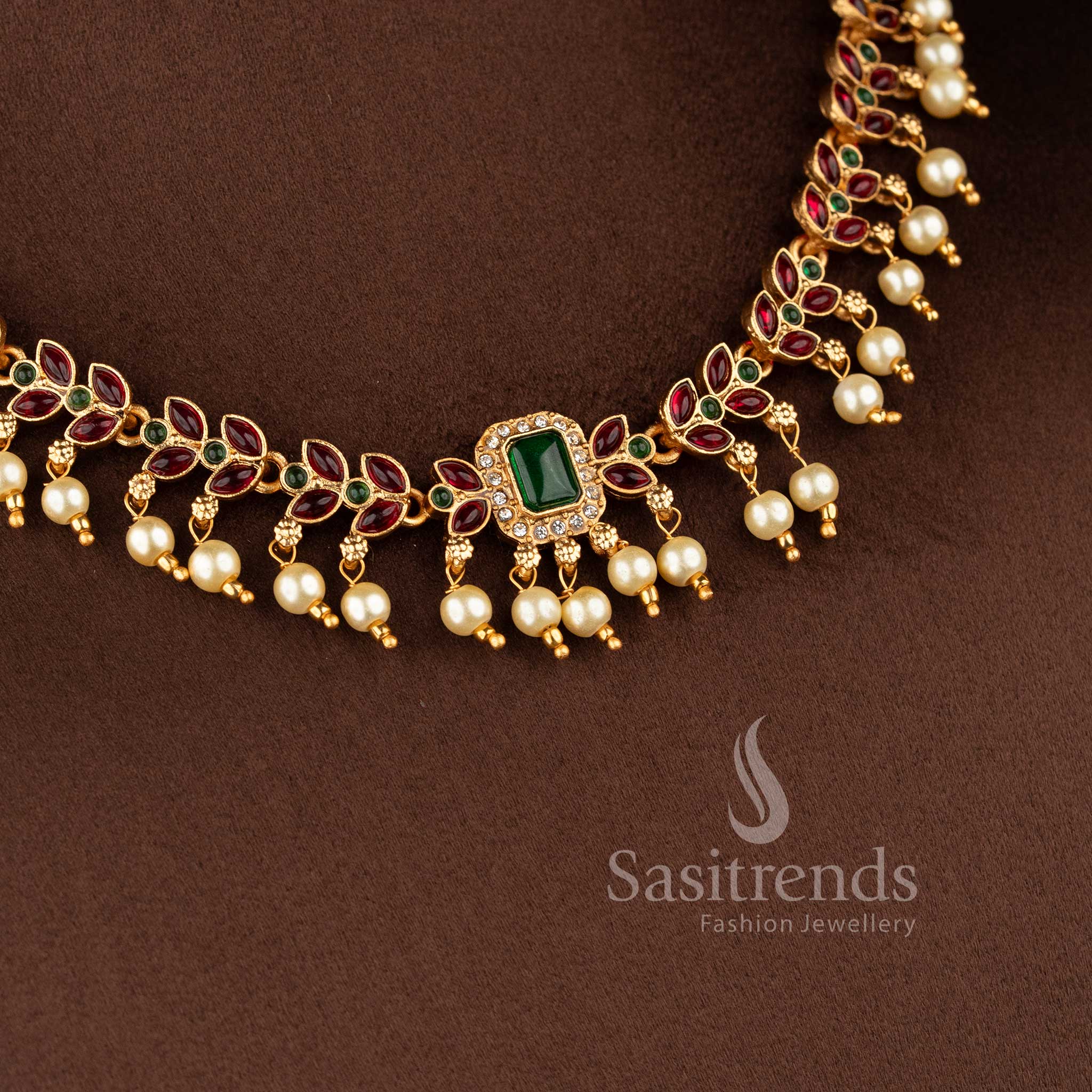 Designer ethnic necklace featuring leaf-inspired patterns with hanging pearl accents - Sasitrends