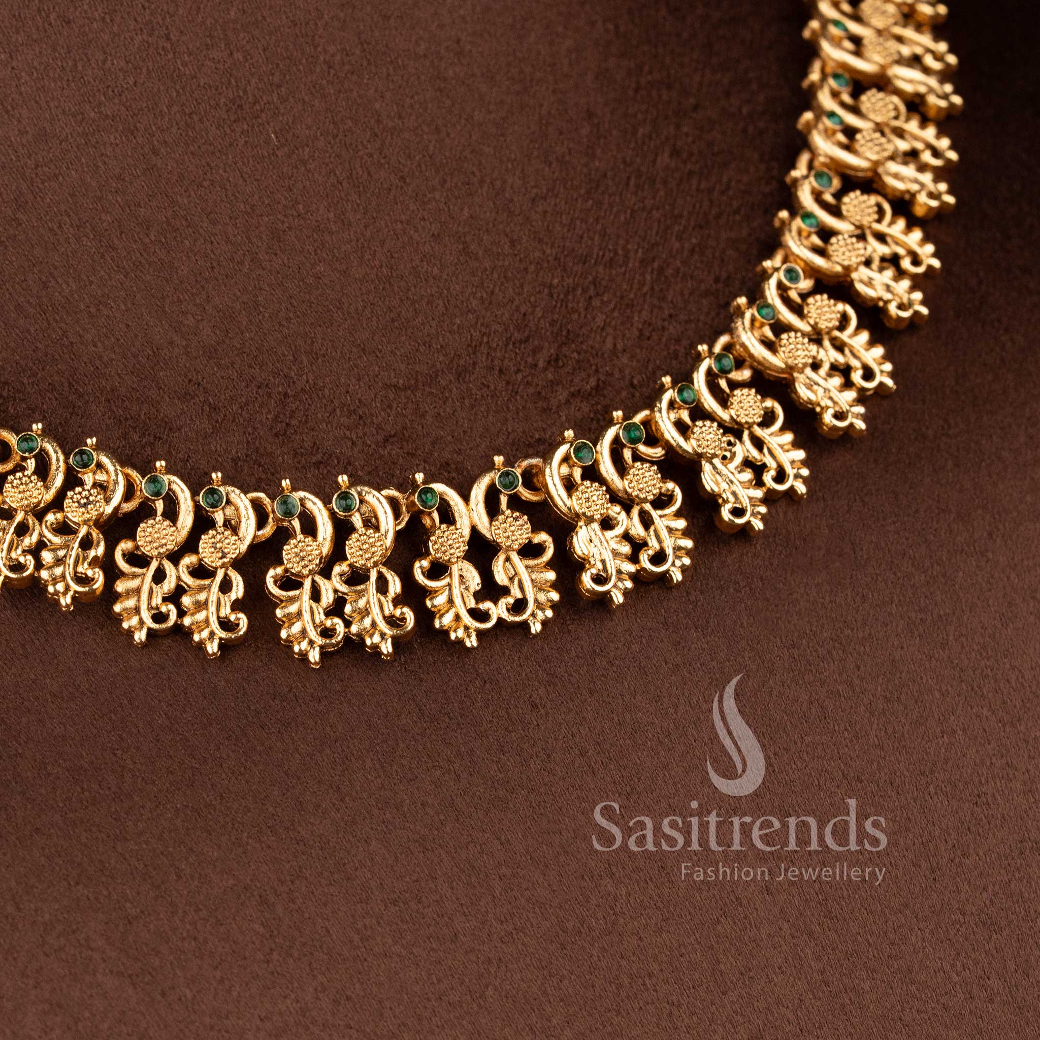 Traditional South Indian style matte gold plated necklace set with intricate peacock motifs - Sasitrends.