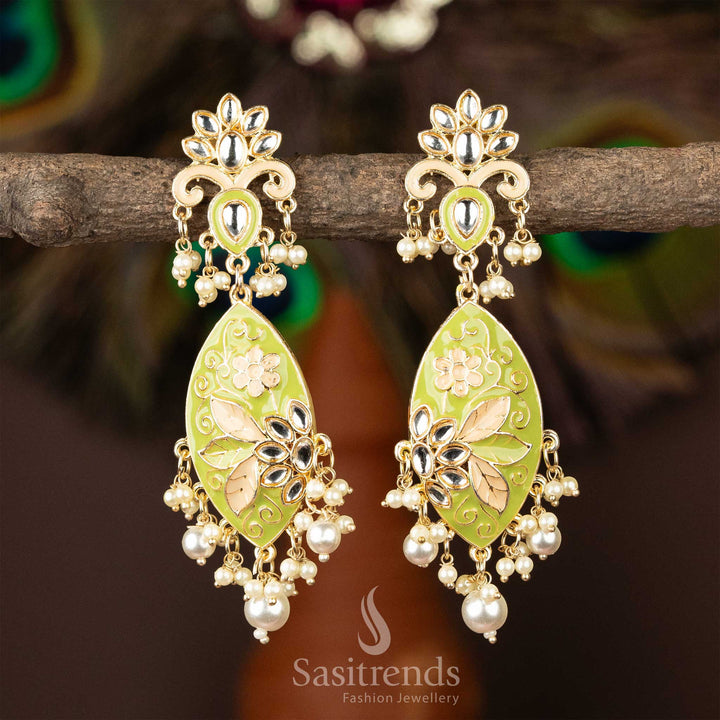 Gold-plated kundan earrings with vibrant green enamel and pearl accents.