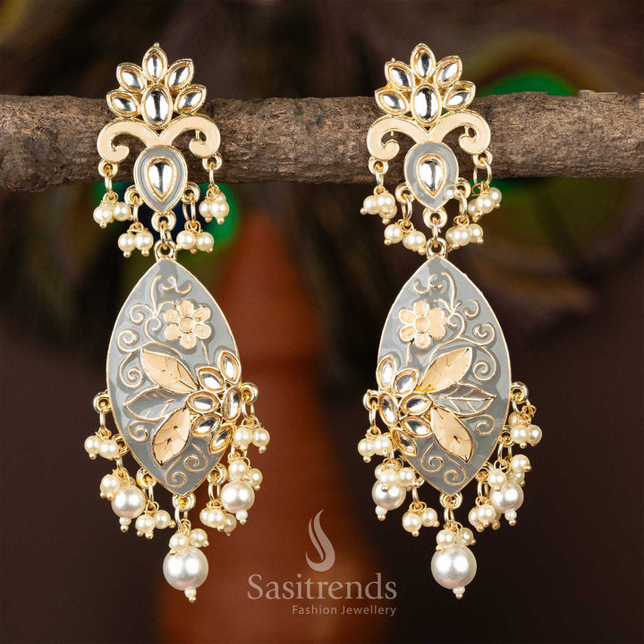 Exquisite gold-plated kundan earrings with grey enamel detailing and pearls.