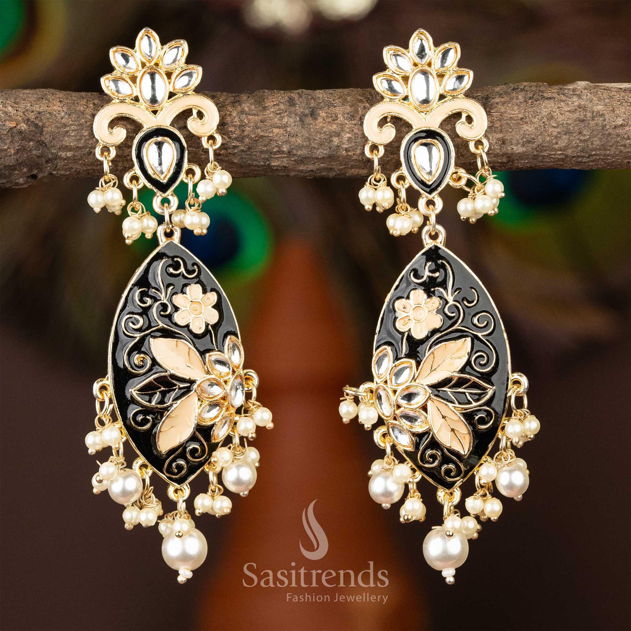Classic black enamel kundan earrings with gold plating and pearl adornments.