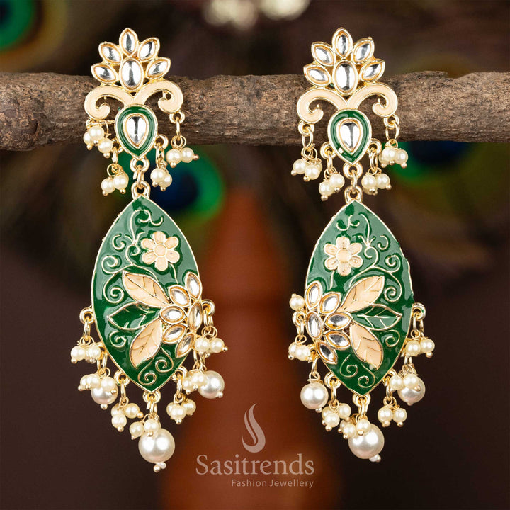 Elegant dark green enamel kundan earrings with gold plating and lustrous pearls.