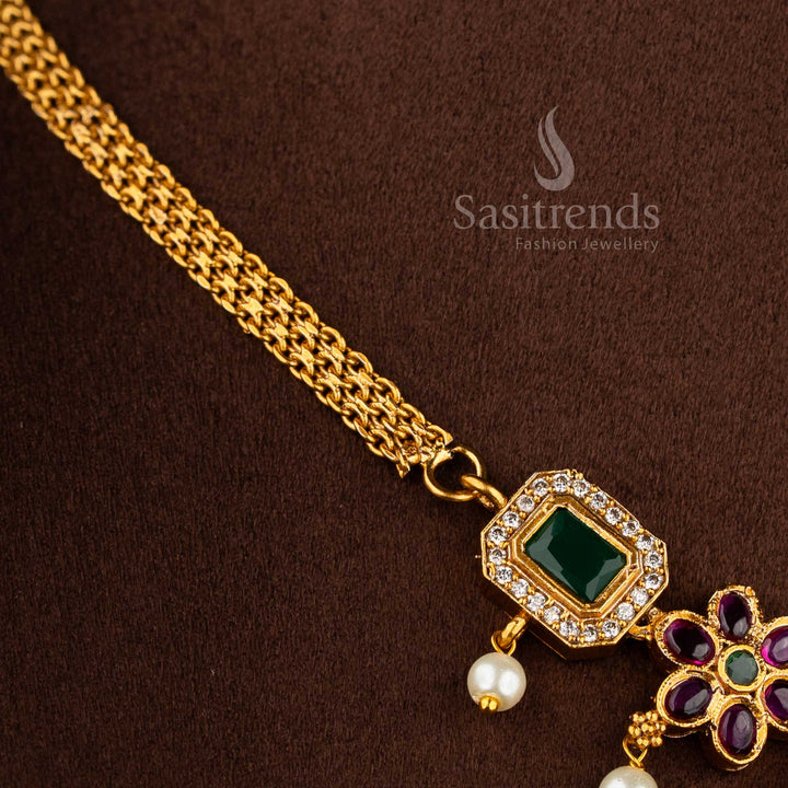 Matte gold plated floral attigai necklace jewellery set with AD stones for weddings and festive wear.