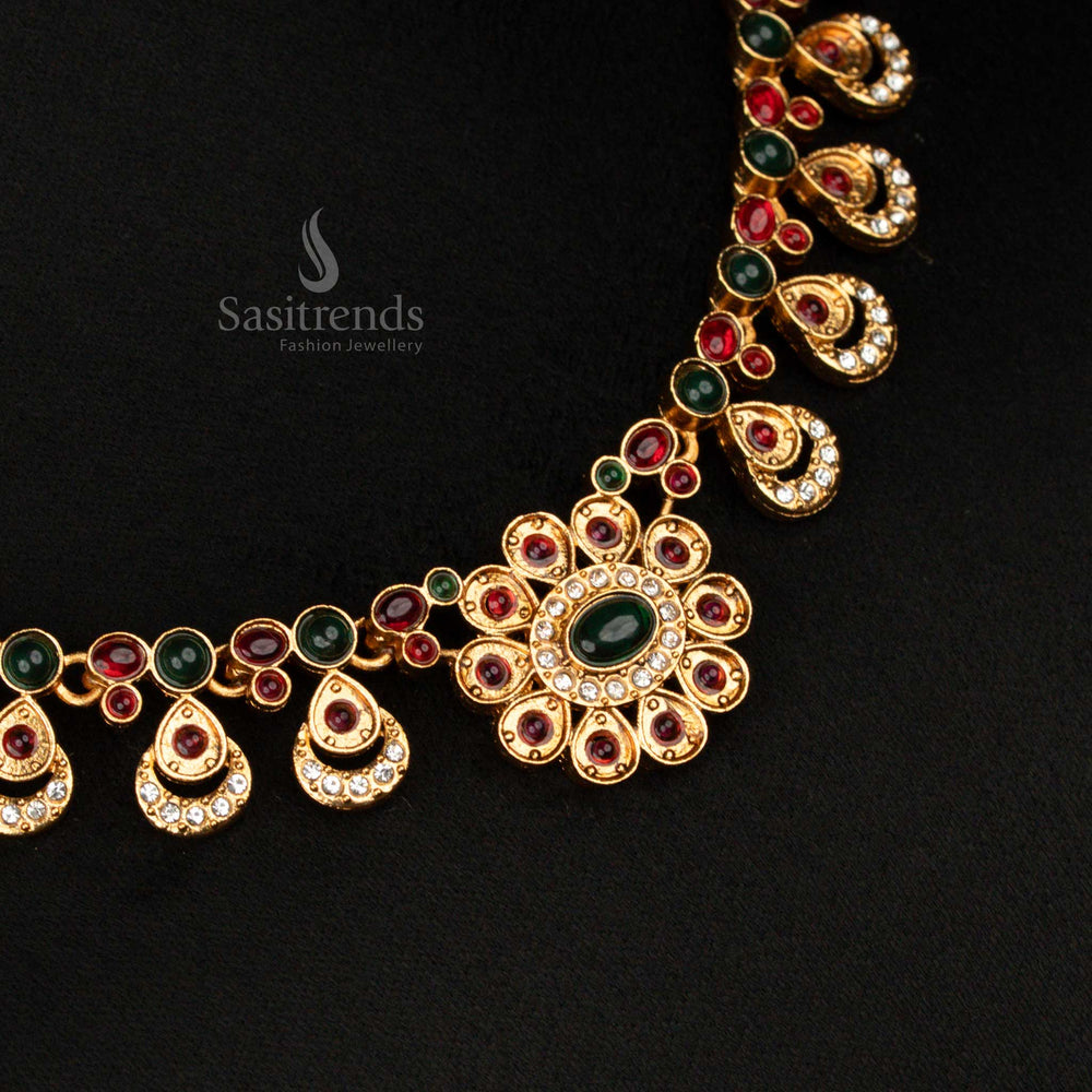 Elegant green-ruby matte gold toned traditional necklace set with floral centrepiece and oval motifs – perfect ethnic jewellery for cultural occasions and traditional sarees – Sasitrends