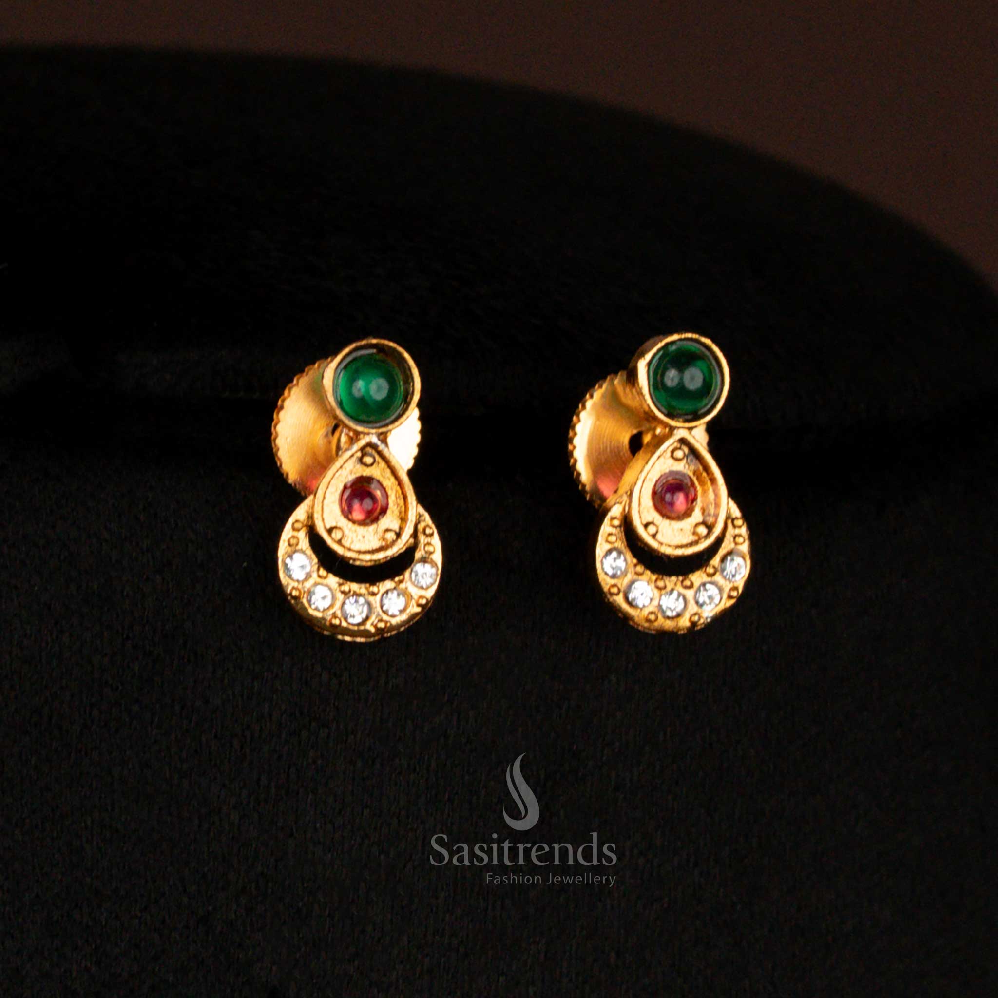 Traditional green matte gold plated earrings set with floral center and oval motifs – heritage-inspired jewellery perfect for women in sarees during wedding celebrations – Sasitrends