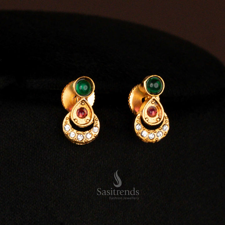 Traditional green matte gold plated earrings set with floral center and oval motifs – heritage-inspired jewellery perfect for women in sarees during wedding celebrations – Sasitrends